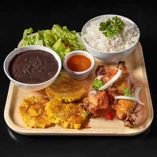 Chicken Fried (served with plantain and 1 choice of white rice, rice and beans, djondjon rice or white rice and beans sauce)
